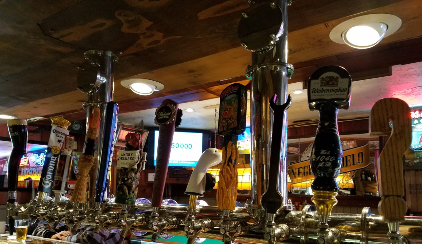Craft beer tap handles at bar